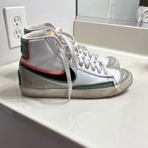 White, Orange, blue/green high top Nike Balzers, size 8 in women’s.